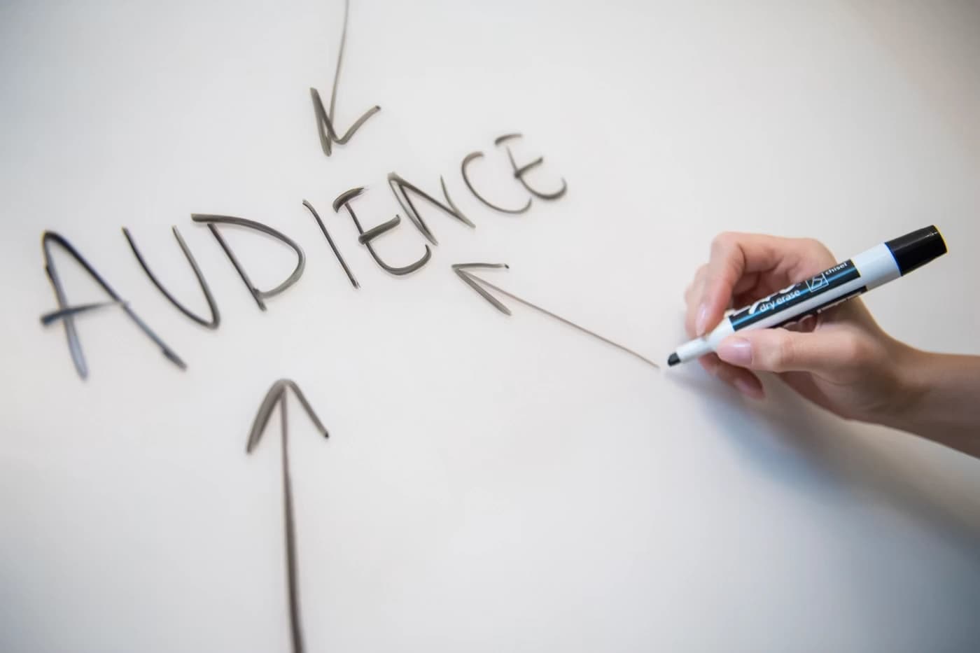 audience writing on white board