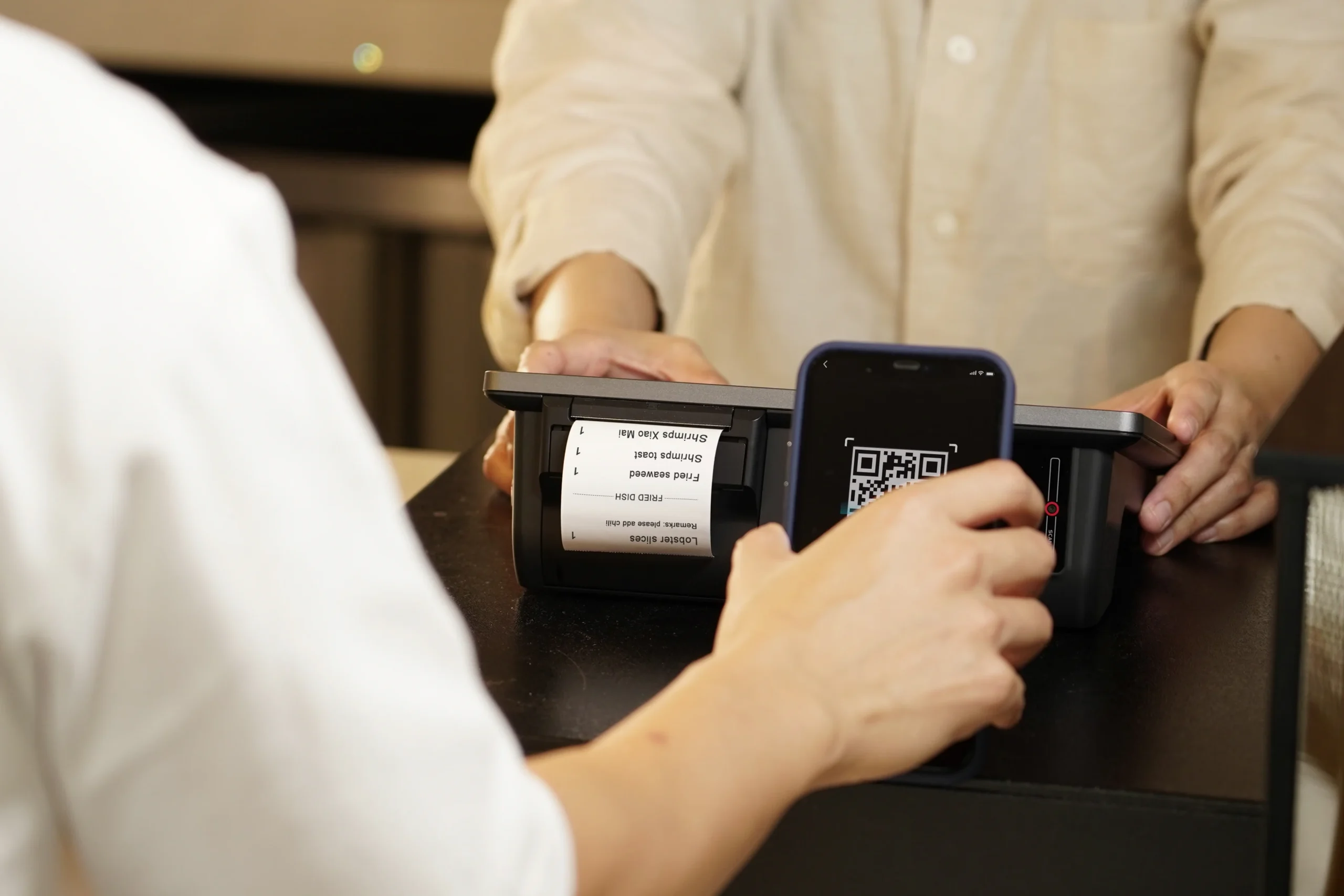 person paying with a qr code